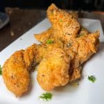 Hand-Breaded Chicken Tenders - Fresh, hand-breaded chicken in seasoned flour and fried golden brown
