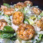 Caesar salad with Shrimp - Fresh romaine lettuce + creamy Caesar dressing, topped with shaved parmesan cheese & croutons