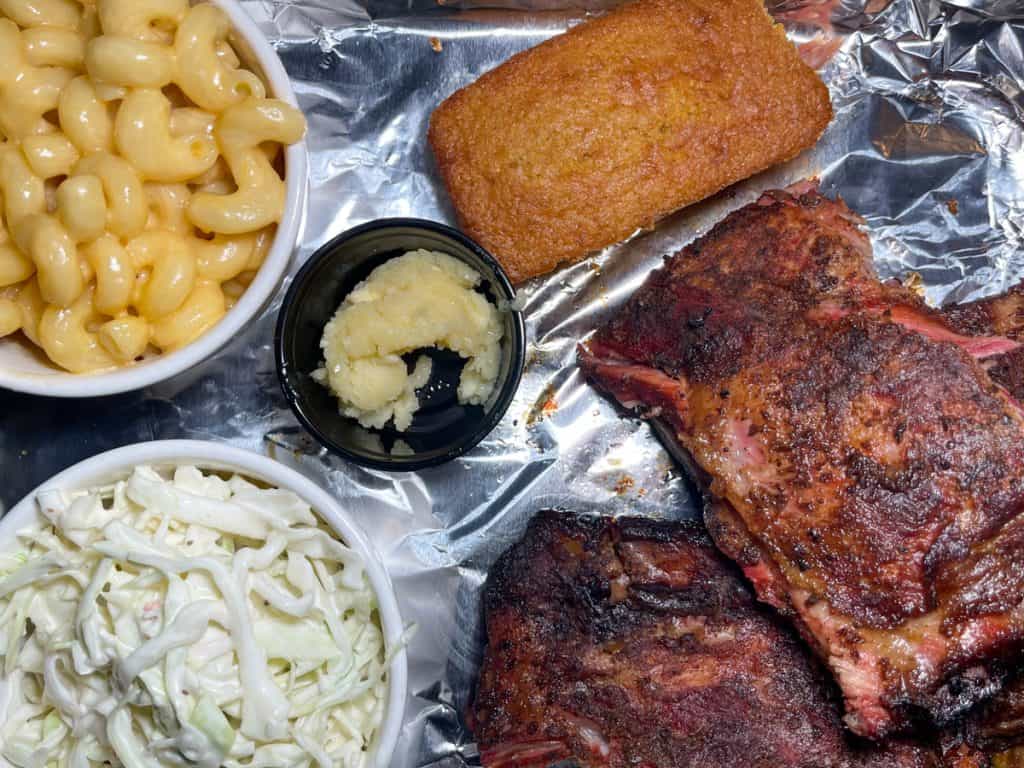 Top down look at Half Rack of Ribs Combo with Cole Slaw, Mac & Cheese, and Cornbread with Honey Butter