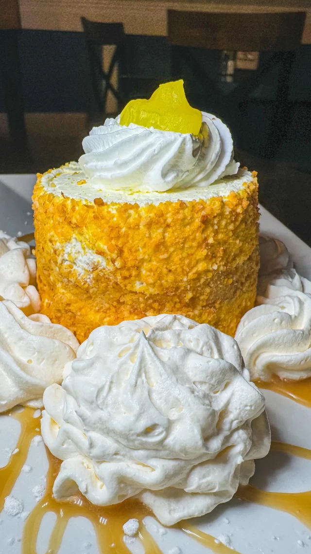 Brighten up your dessert dreams with our Lemon Mousse Cake! 🍋 This featured delight layers soft vanilla cake with light, airy lemon mousse, then finishes it off with a sprinkle of graham cracker crumbs and a zesty lemon accent. It’s the perfect blend of sweet and citrus, ready to transport your taste buds to a sunny state of bliss. Come in and savor the freshness—it’s a slice of heaven waiting just for you!